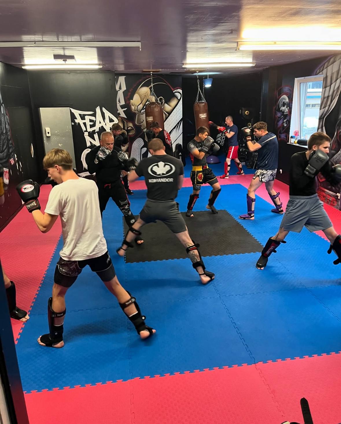 Group training session with sparring at the gym