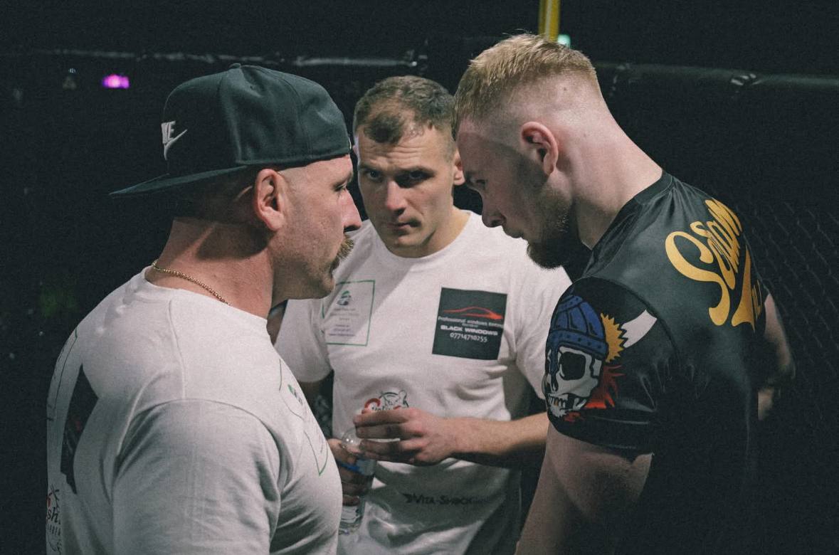 Mark coaching fighters before a cage match